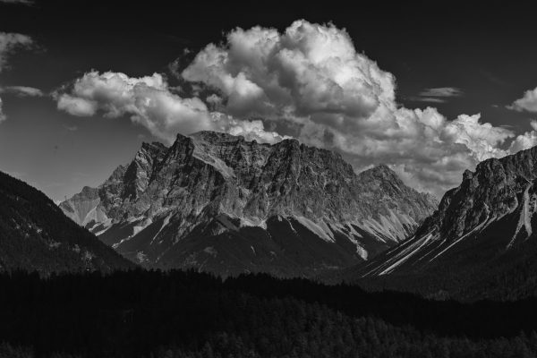 zugspitze from far away, with a cloud on top on a sunny mid-day